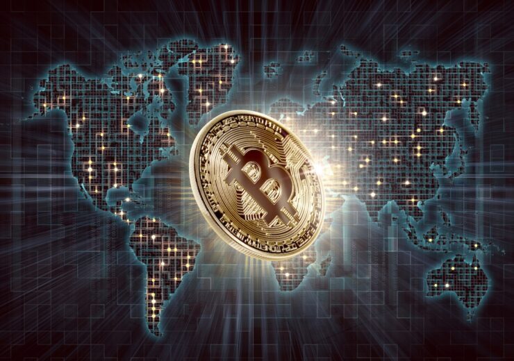 Gold bitcoin and digital world map background. Cryptocurrency image concept